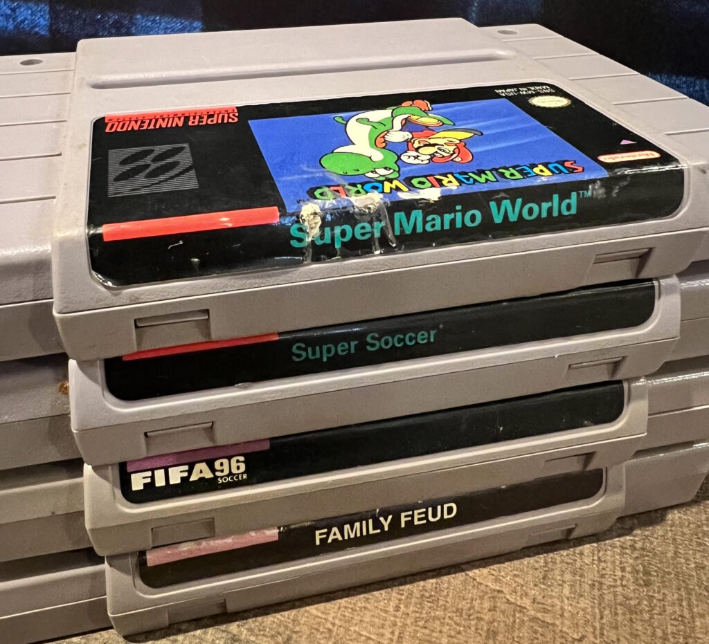 Stack of Super Nintendo (SNES) games